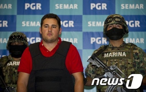 21일 체포된 멕시코 최대 마약 카르텔 '시날로아'의 헤수스 알프레도 구스만. © AFP=News1  