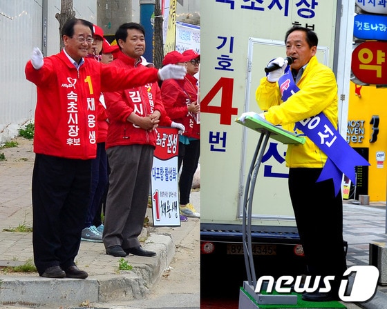 6·4지방선거를 이틀 앞둔 2일 새누리당 채용생 속초시장 후보(좌)가 주공4차 사거리에서, 무소속 이병선 후보(우)는 시가지에서 시민들을 향해 유세활동을 펼치고 있다. 2014.6.2/뉴스1 © News1   엄용주 